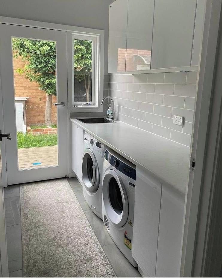 Efficient laundry room with custom storage and workspace Sydney